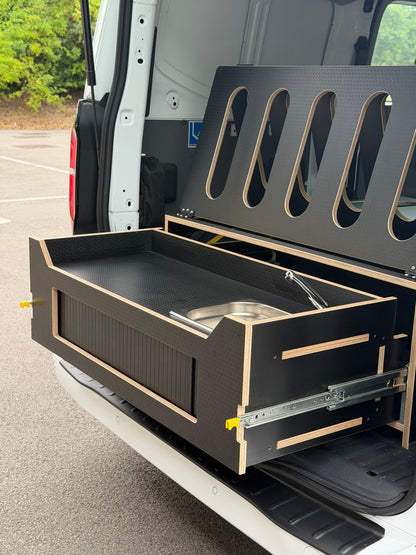Camper van kitchen and sink on the Discovery pod fitted in the back of a van