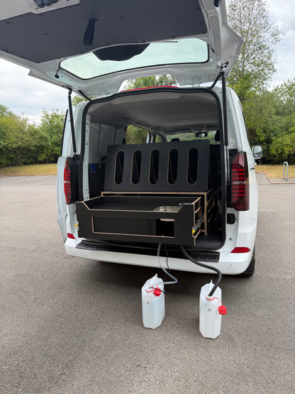 Van with the Discovery camping pod and pull-out kitchen, ready for a camping trip