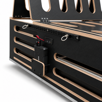 Side view of the Discovery van camping pod with lashing rail for strapping in without drilling